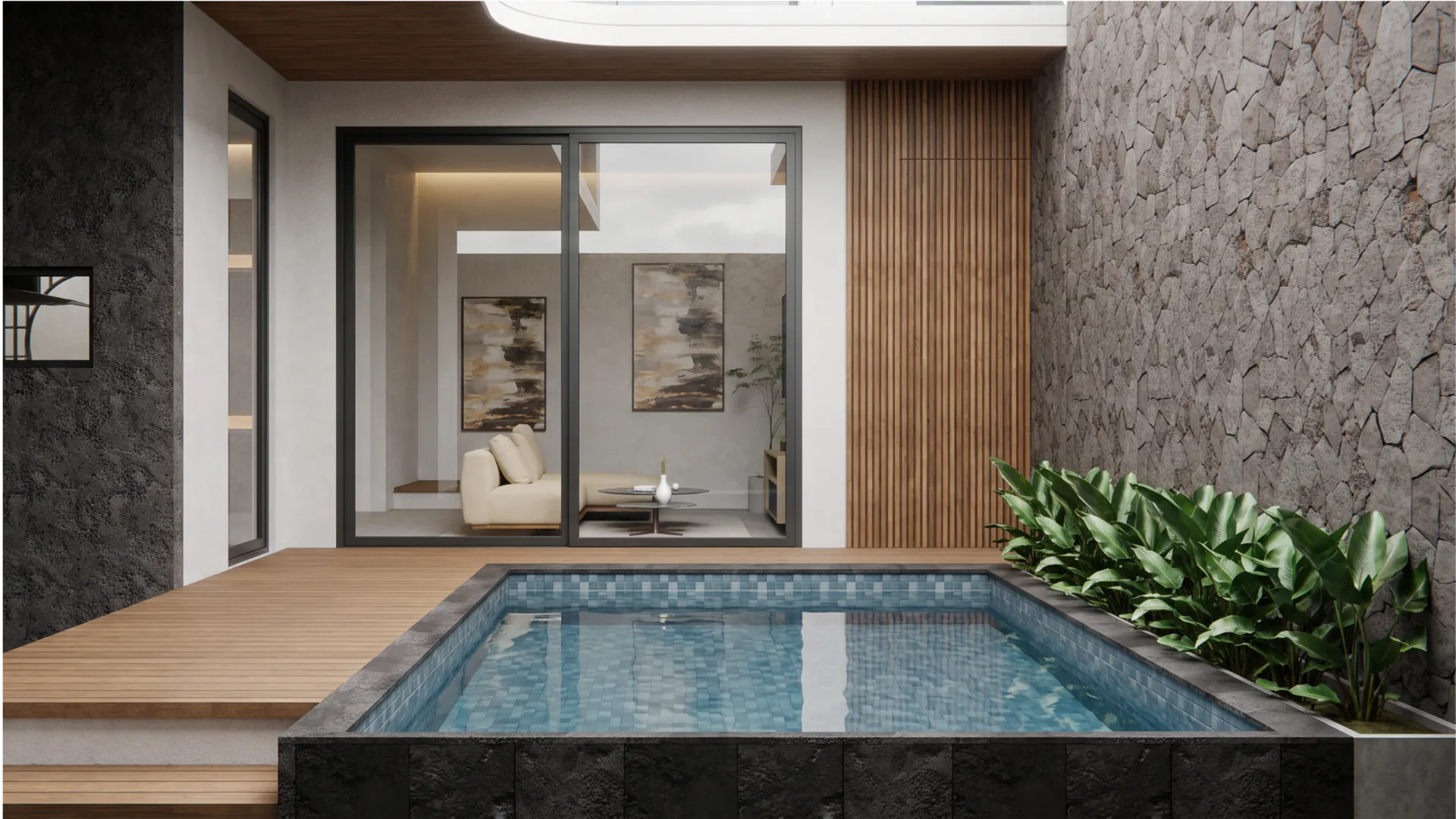 The private pool courtyard against its natural stone wall