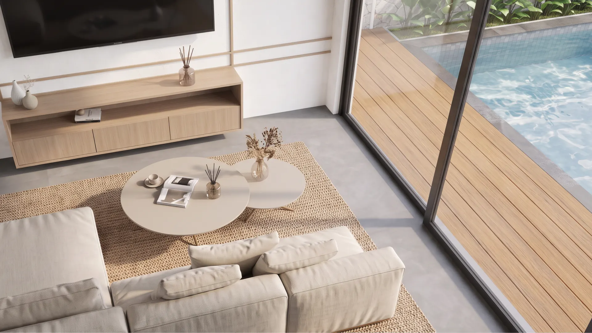 Living room seen from above, opening to the pool deck