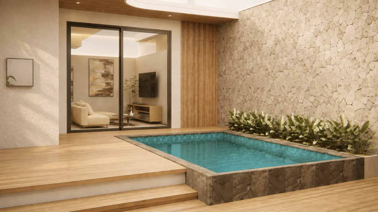 The pool courtyard seen from the timber deck steps, the living room visible through a wide sliding door.